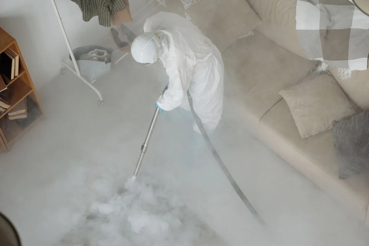 Biohazard cleanup technician in protective equipment, Clairton, PA